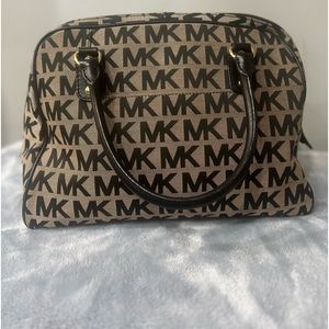 Michael Kors Black and grey signature bag. Has black and gold hardware